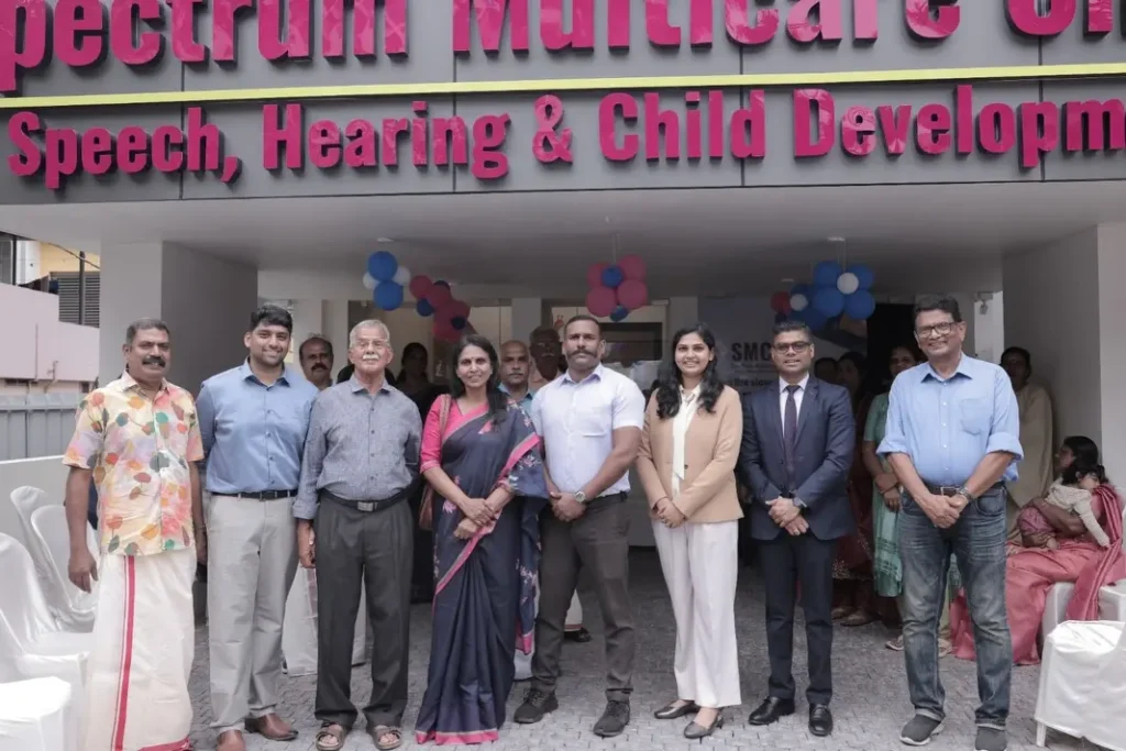 Spectrum Multicare Clinic inauguration in Trivandrum with guests and healthcare professionals at the clinic entrance